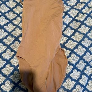 Tan leotard which is worn under a costume, Capezio, size small